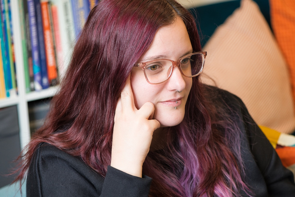 Co-founder Cat with purple hair and glasses