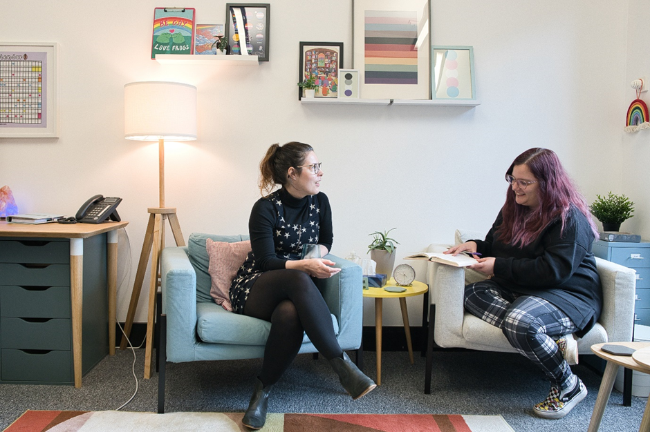 Two women sitting in chairs